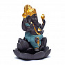 Stand for incense cones with flowing smoke of Ganesha on a lotus flower