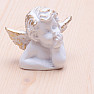 Little angel for luck in a bust gift bag with a hand on his face