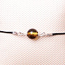 Fashionable string bracelet with a green amber bead and Ag 925 silver