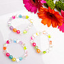 Children&#39;s bracelet made of colorful acrylic beads with hearts and stars