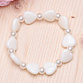 Children's bracelet made of white hearts with pearls