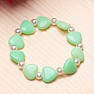 Children's bracelet made of green hearts with pearls