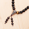 Wrap chakra bracelet made of black wooden beads in Tibetan style