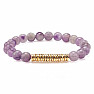 A set of four bracelets made of amethyst, rhodonite, wooden beads and metal