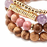 A set of four bracelets made of amethyst, rhodonite, wooden beads and metal