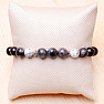 Bracelet made of wooden beads with larvikite