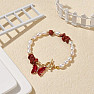 White pearl bracelet with red jasper and butterfly