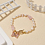 Bracelet made of white pearls with rose quartz and butterfly