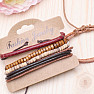 Set of five fashion imitation leather and wood bracelets