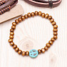 Set of four fashionable imitation leather bracelets and wood peace sign