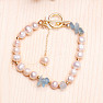 Bracelet made of white pearls with aquamarine