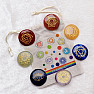 Chakra set of stones with chakra symbols in a Chakraset I bag