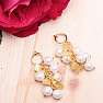 Fashion earrings with a bunch of mother of pearl pearls and citrines