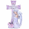 Statuette of an angel at the cross with a rose