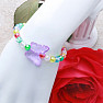 Children&#39;s bracelet with colorful pearls and a butterfly