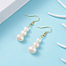 Fashionable earrings with three pearls