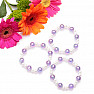 Children&#39;s bracelet made of purple acrylic beads with pearls