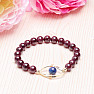 Garnet fashion bracelet with metal ornament