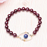 Garnet fashion bracelet with metal ornament