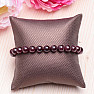 Garnet fashion bracelet with metal ornament