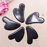 Gua sha made of hematite heart shape