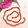 Polished baroque amber necklace in cognac color