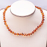 Polished baroque amber beads for children color cognac