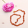 Flat amber beads for children, color cognac