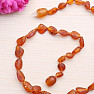 Flat amber beads for children, color cognac