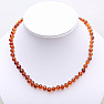 Amber necklace polished baroque in cognac color