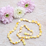 Amber natural necklace made of polished beads of butter color