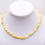 Amber natural necklace made of polished beads of butter color