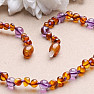 Amber beads for children baroque cognac color with amethyst