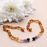 Amber beads for children polished in the color of cognac with a mix of semi-precious stones