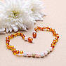 Amber beads for children polished in cognac color with morganite