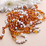 Amber beads for children polished in cognac color with morganite