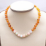 Amber beads for children polished in cognac color with morganite