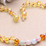 Amber beads for children polished in the color of lemon and cognac with morganite