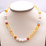 Amber beads for children polished in the color of lemon and cognac with morganite