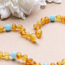 Amber beads for children satin cognac with aquamarine