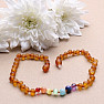 Amber beads for children satin-finished in the color of cognac chakra