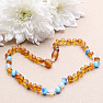 Amber beads for children satin in the color of cognac with ulexite and opalite