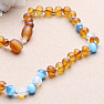 Amber beads for children satin in the color of cognac with ulexite and opalite