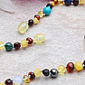 Amber beads for children with colored gems