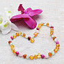 Amber beads for children with rose quartz, agate and ulexite