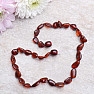 Flat amber beads for children, color dark cognac