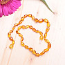 Amber beads for children polished beans in honey color