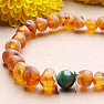 Cognac amber bracelet with a jadeite bead