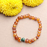 Cognac amber bracelet with a jadeite bead