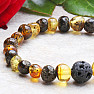 Green amber bracelet with a lava bead